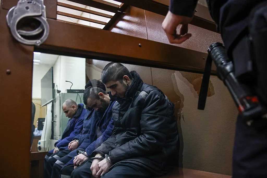Фигуранты дела о теракте в «Крокус сити холле» Саидакрами Рачабализода, Шамсиддин Фаридуни, Далержон Мирзоев и Мухаммадсобир Файзов. Фото © ТАСС / Михаил Терещенко